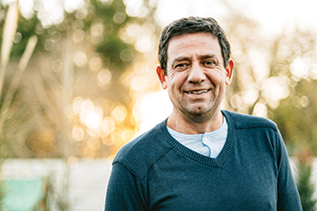 A man smiling. Links to Gifts That Protect Your Assets