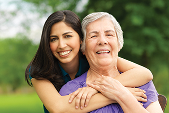 Two women smiling. Links to Beneficiary Designations
